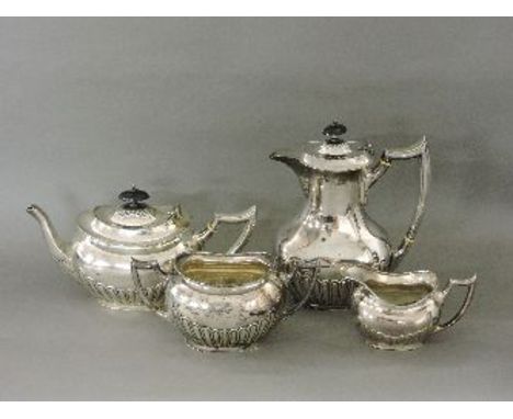 A Victorian silver plated four piece tea service, of oval form with part reeded bodies