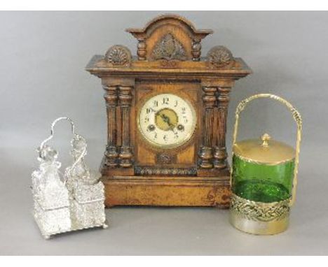 A mantel clock, a silver plated cruet set, and a green glass biscuit barrel