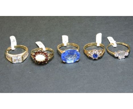 A 9ct gold opal and garnet cluster ring, a 9ct gold synthetic spinel cluster ring, a 9ct gold cubic zirconia ring, a 14ct gol