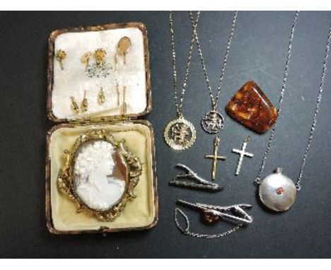 Two gold crucifixes, two 9ct gold Zodiac pendants or chains, four gold tie pins and one shank, cameo brooch, amber brooch, tw