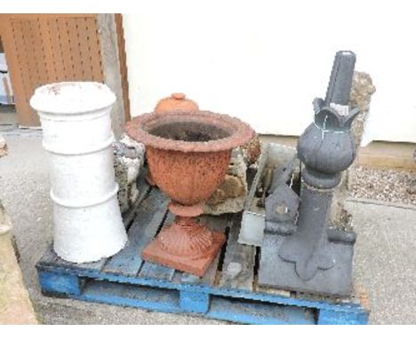 Garden items, iron urn, pottery roof finial, two pedestals with shells, a composition cherub, and a lead trough