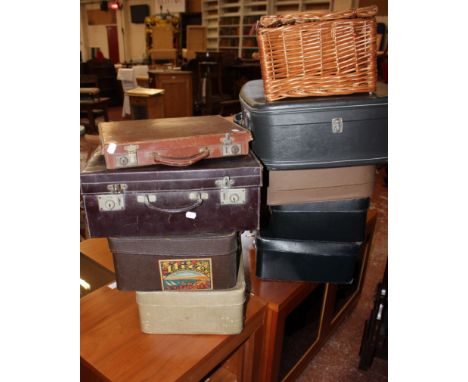 A quantity of vintage suitcases