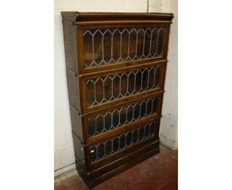 A pair of Globe Wernicke style four tier oak bookcases, one bearing labels 141cm high, 86cm wide 