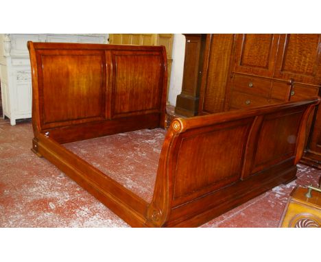 A mahogany sleigh bed surround 227cm high, 207cm wide 