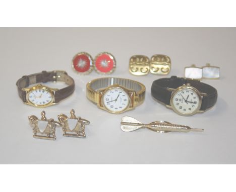 A mixed lot to include a locket, cufflinks, wristwatches, enamel badges etc 