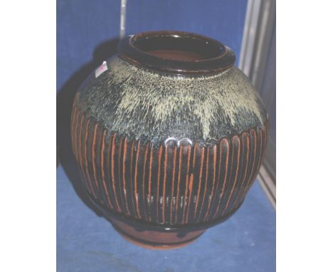 Mike Dodd (b.1943), a fluted vase, with an ash glaze, obscured seal mark, label , 24cm high