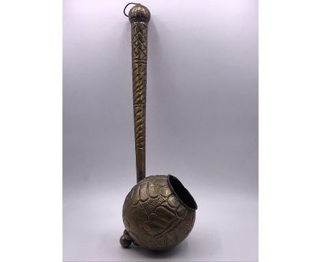 A Hammered antique measure or ladle.