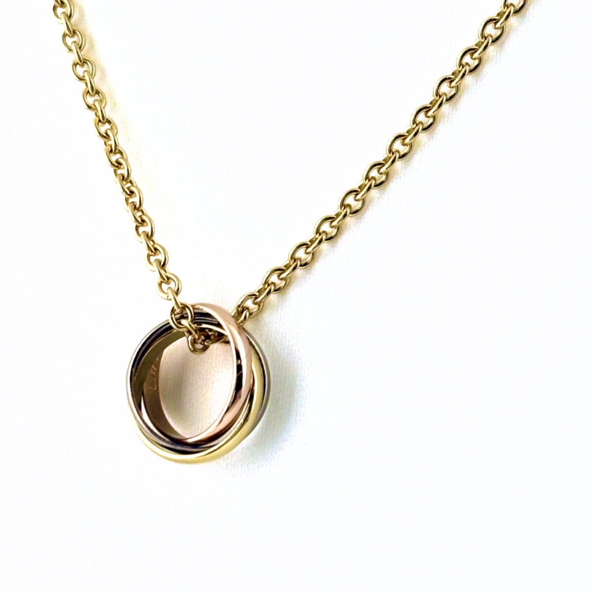 Cartier Baby Trinity Necklace in Yellow Gold, Pink and White Gold. Three-tone pendant necklace, 750,