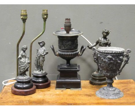 A spelter campana type lamp base on ebonised plinth 27cm high, together with a Victorian spelter vase decorated with cherubic