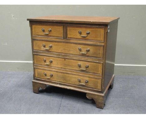 A Georgian style mahogany chest of drawers on bracket feet, comprising of two short over one long and one double drawer on br