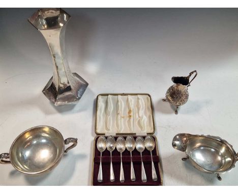 A silver vase, a silver bowl, silver sauce boat, silver cream jug and a cased set of six silver shell bowled teaspoons, 20ozt