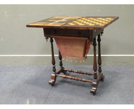 A 19th century inlaid rosewood games table, the fold over swivel top enclosing an inlaid backgammon and chess board, 71 x 75 