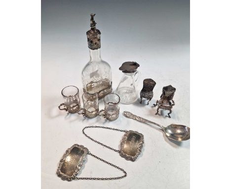 A Dutch silver liqueur decanter with three glasses, together with two miniature Dutch style silver chairs, an American silver