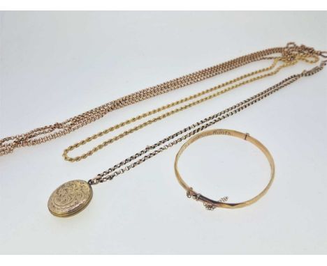 A guard chain, tested as 9ct gold, a hallmarked 9ct gold rope chain, a bangle stamped '9C GOLD SILVER CORE', and a base metal