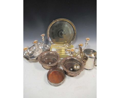 A large quantity of silver plated ware to include candlesticks, trays, bottle coasters, flatware etc