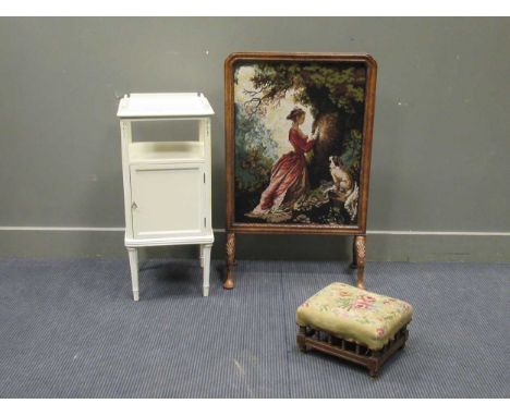 A walnut frame tapestry fire screen, early 20th century 96 x 60cm, a white painted bedside cabinet 77 x 36 x 35cm and a needl