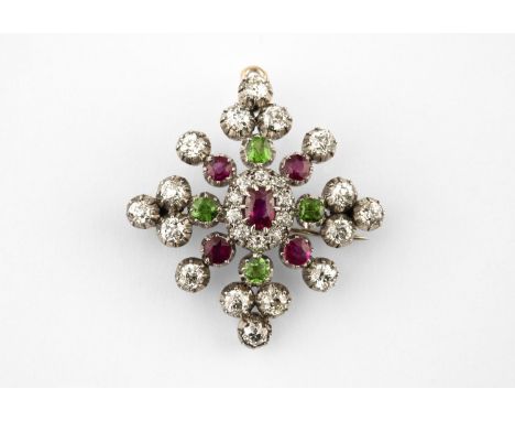 AN EARLY 20TH CENTURY DIAMOND, RUBY AND DEMANTOID GARNET SNOWFLAKE BROOCH PENDANT centred with a ruby and diamond cluster and