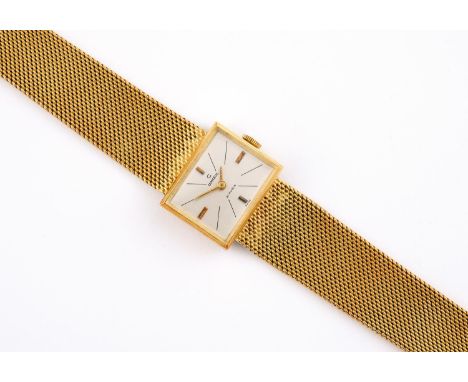 A LADY'S  18CT GOLD SWISS WRISTWATCH BY CONSUL with signed rectangular dial, on a gold mesh bracelet with ladder clasp, 16cm 