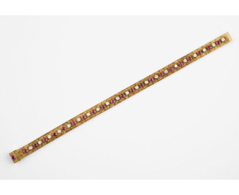 AN 18CT GOLD, RUBY AND DIAMOND BRACELET the gold bracelet mounted with circular-cut rubies and diamonds, 19cm long, circa 196
