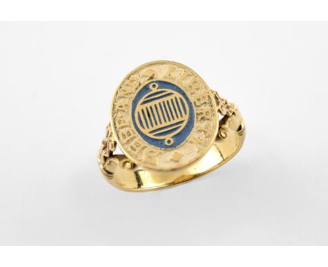 A GOLD AND ENAMEL 'SUBLIME SOCIETY OF BEEF STEAKS' RING with blue and white enamel decoration depicting a gridiron the emblem
