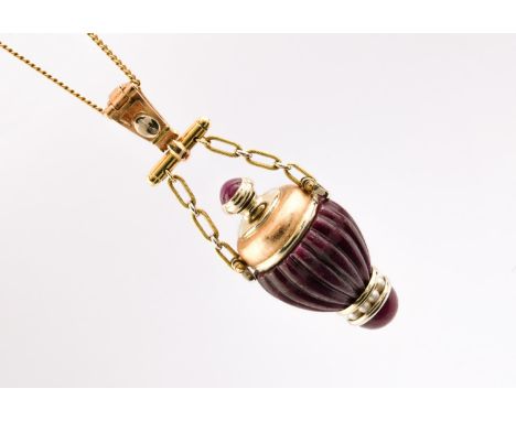 A CARVED RUBY AND GOLD SCENT BOTTLE PENDANT mounted with small pearls and set in 18ct gold, on a fine link 18ct gold chain, 7