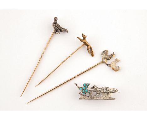 A ROSE-CUT DIAMOND SET GROUSE STICK PIN together with a gold running fox stick pin, an enamel and gold cockerel stick pin and