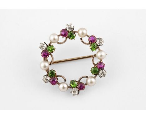 A DIAMOND, PEARL AND GEM SET CIRCLE BROOCH mounted with trefoil flowerheads of a circular diamond, ruby and demantoid garnet,