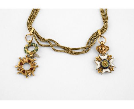 A GOLD HERRINGBONE LINK BRACELET formed with three strands, suspending two enamel charms, one depicting the Sicilian Order of