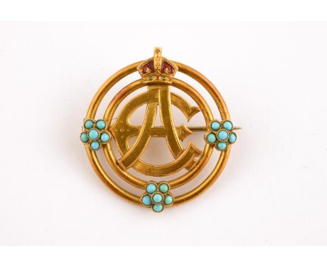 A GOLD, TURQUOISE AND ENAMEL ROYAL PRESENTATION BROOCH formed with the joint cypher for King Edward VII and Queen Alexandra, 