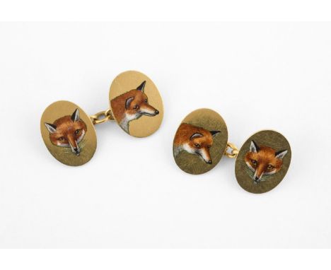 A PAIR OF 18CT GOLD AND ENAMEL FOX MASK CUFFLINKS of oval shape, each depicting the head of a fox, 9.8 grams