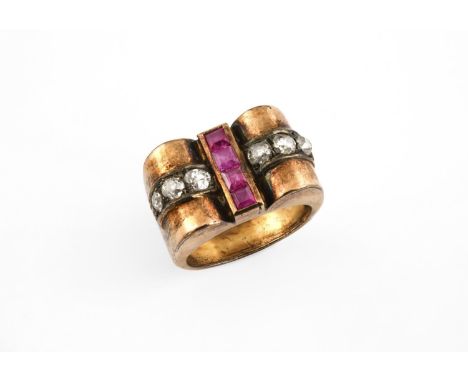 A RUBY AND DIAMOND COCKTAIL RING mounted with four calibre-cut rubies and six old cushion-shaped diamonds in yellow gold. Siz