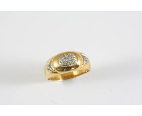A DIAMOND AND GOLD RING the gold band is mounted with circular-cut diamonds. Size R
