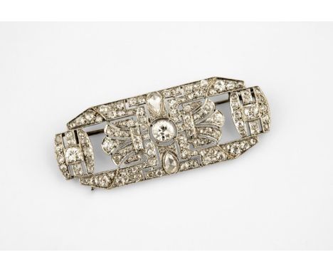AN ART DECO DIAMOND PLAQUE BROOCH the openwork geometric design set with two pear-shaped diamonds and overall with graduated 
