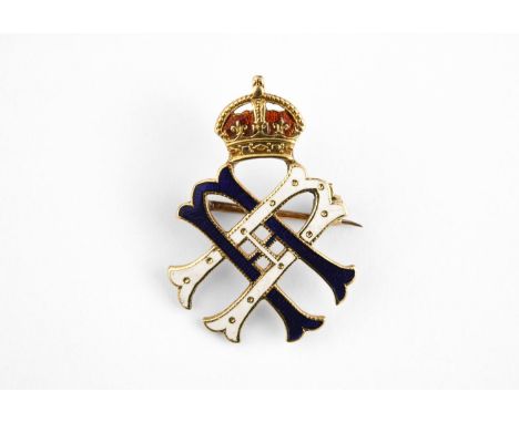 A GOLD AND ENAMEL ROYAL PRESENTATION BROOCH formed with the cypher of Queen Alexandra with blue and white enamel decoration, 