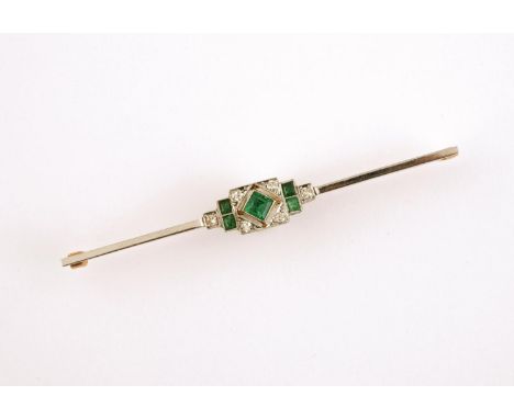 AN ART DECO EMERALD AND DIAMOND BROOCH mounted with square-shaped emeralds and millegrain set with circular-cut diamonds, in 