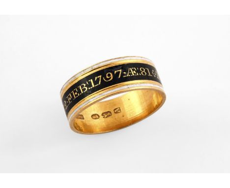 A GEORGE III GOLD MOURNING RING with white and black enamel decoration, inscribed Sr Jn o Filmer Bart OB 22 Feb 1797 AE 81. S