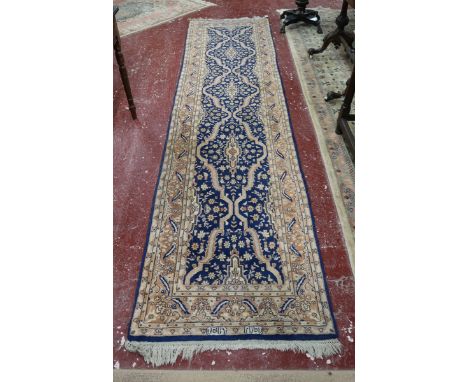 20thC super quality Kashmir handwoven woolen runner, with blue ground and gold border. 319cm x 84cm