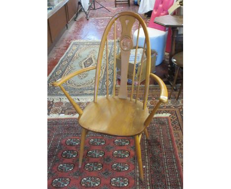 Blonde elm Ercol swan back armchair 