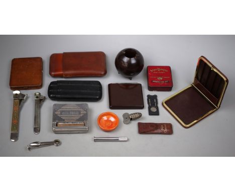 Collection of Cigar, cigarette and pipe smoking ephemera, including cigar cutters, leather Dunhill cigar and cases, Bakelite 