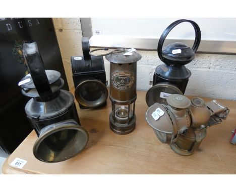 Five railway lanterns together with miners lamp 