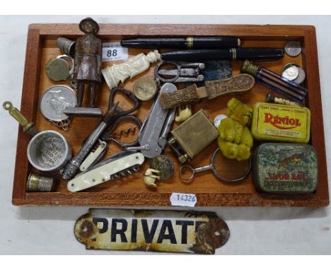 Miniature teddybear, tins, compass, Girl Guide figure, etc.