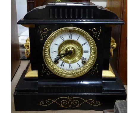 Slate 2-train mantel clock with lion mask ring handles.