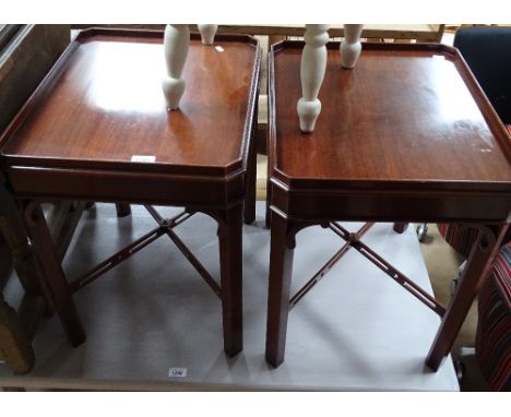 Pair of reproduction mahogany lamp tables on cross stretchers, length 50cm, height 55cm.