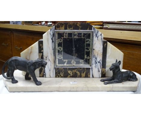 An Art Deco marble continental mantel clock with spelter animals.