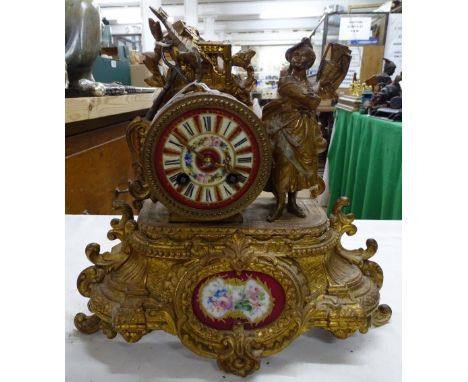 Continental gilded metal clock with spelter figure.