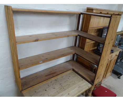 A polished pine 4-tier corner bookshelves, H106cm, L121cm, and a lead light window.