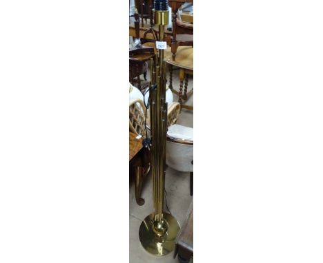 A contemporary designer gilt brass standard lamp of ball and tube design, H146cm.