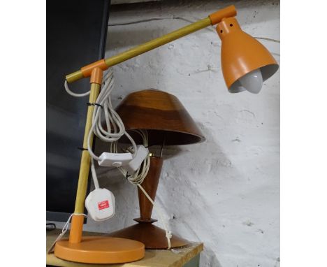 An orange desk lamp and a turned wood lamp.