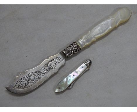 A Victorian silver and carved mother of pearl handled butter knife by George Unite, and a small silver and mother of pearl po