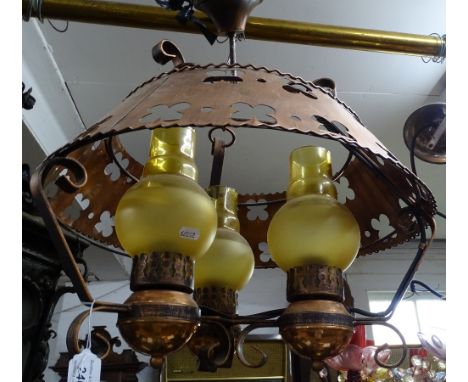 A 3-branch oil lamp style ceiling light with copper shade.